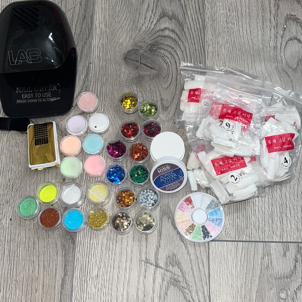 Glitters, nail powder, nails tips, nail dryer with batteries in it.
